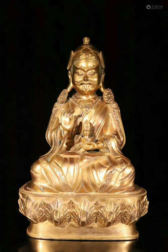 A BRONZE GLITED BUDDHA FIGURE