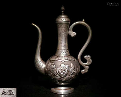 A FINE CARVED FLOWER EWER