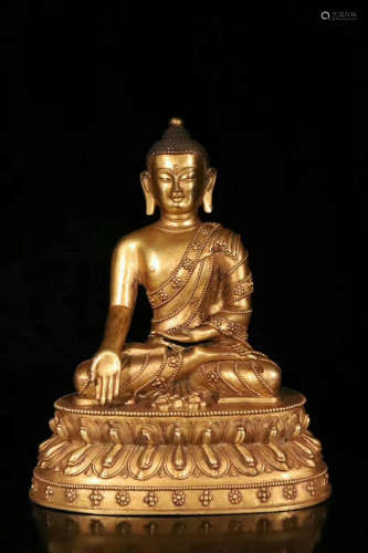 A BRONZE GLITED BUDDHA FIGURE