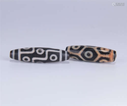 TWO TIBETAN DZI BEADS