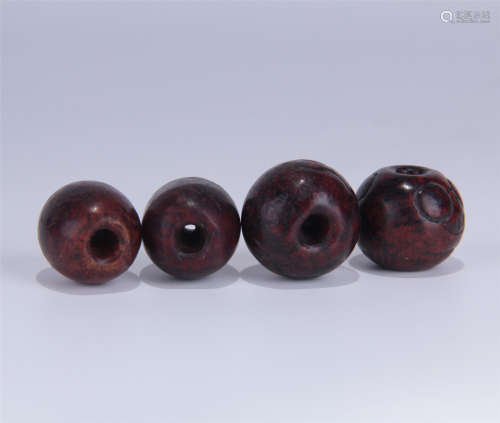 FOUR ANCIENT WOOD BEADS