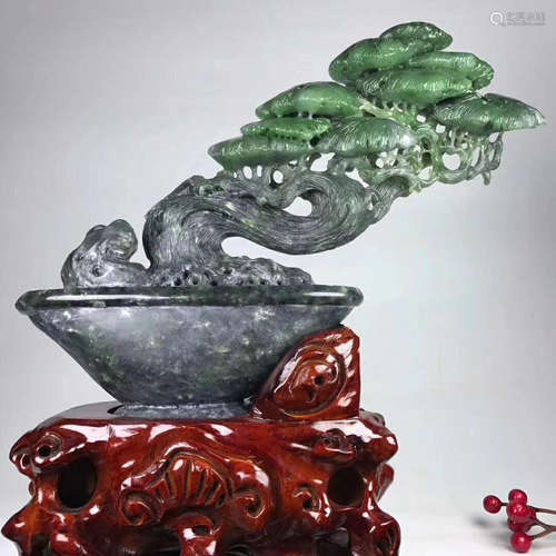 A HETIAN GREEN JADE PINE SHAPED DECORATION