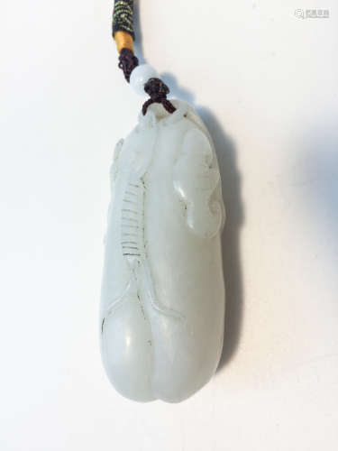 A WHITE JADE CARVED PENDANT