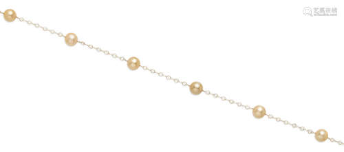 A colored cultured pearl, white topaz and 14k gold long chain