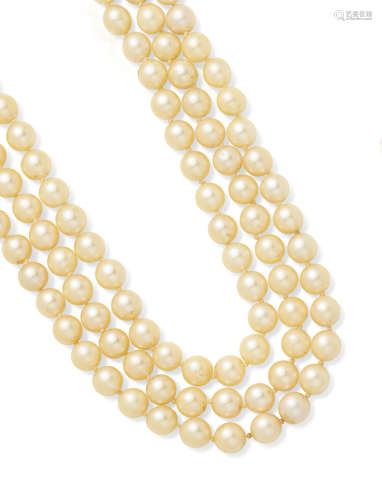A three strand cultured pearl necklace with a white gold clasp