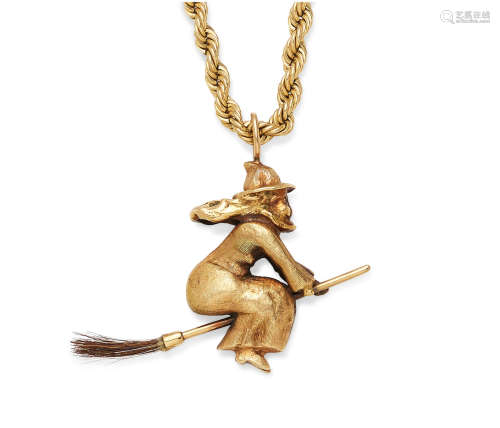 A gold witch pendant on  14K gold rope chain
