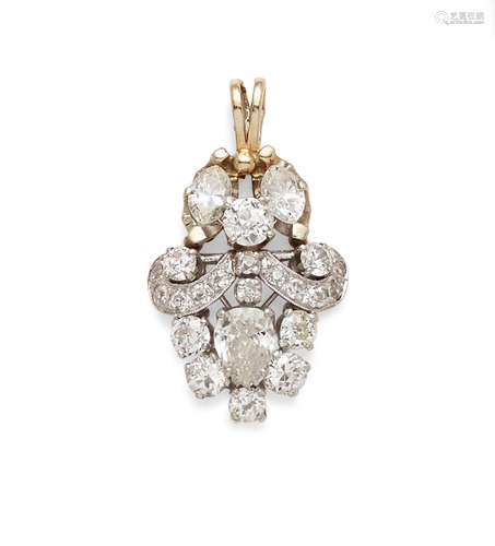 A diamond, white metal and platinum pendant