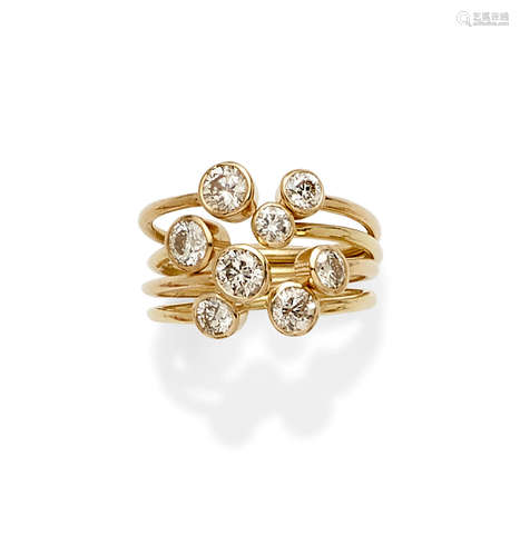 A Collection of Four Diamond and Gold Stacking Rings