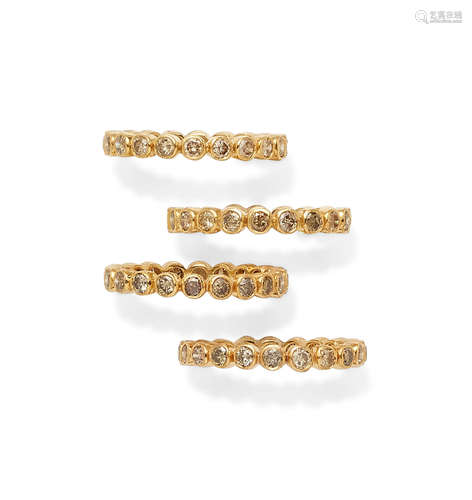 A set of four colored diamond and Rose Gold Bands