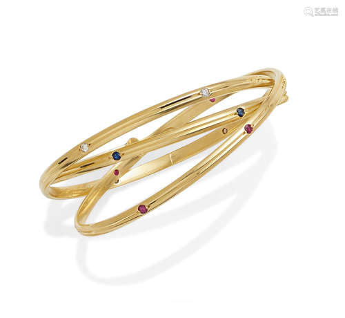 A ruby, sapphire, diamond and 18k gold 'trinity' bangle, Cartier, 1989