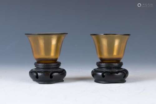 A Pair of Peking Glass Cups with Stands