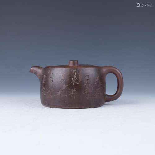 A Flattened Round-Form Brown Teapot