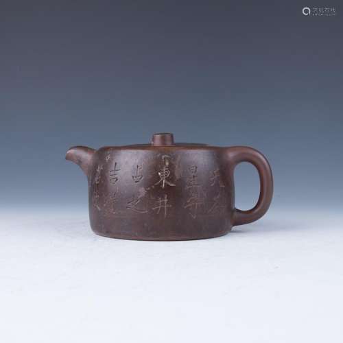 A Flattened Round-Form Brown Teapot