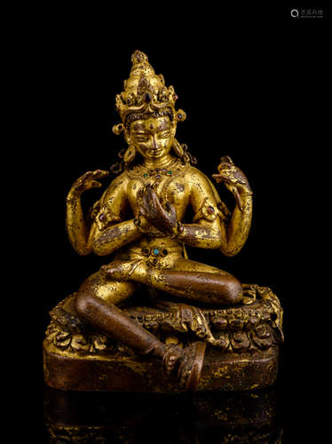 A RARE GILT-BRONZE FIGURE OF PRAJNAPARAMITA