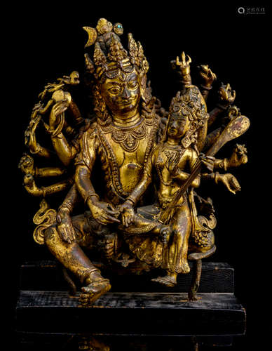 AN IMPORTANT GILT-BRONZE GROUP OF SHIVA AND PARVATI