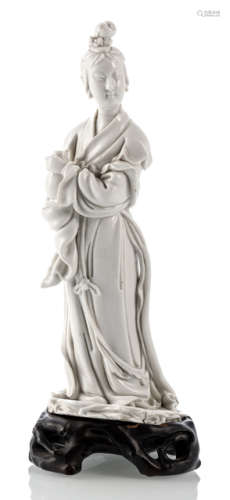 A DEHUA MODEL OF STANDING GUANYIN WITH VASE