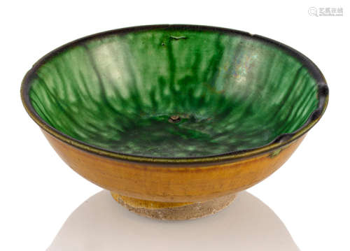 A SMALL BROWN- AND GREEN-GLAZED BOWL