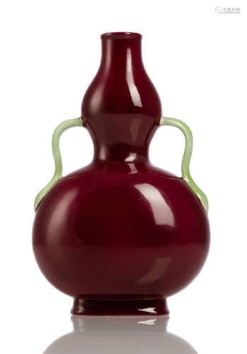 A PUCE-GROUND GOURD-SHAPED FLASK WITH GREEN HANDLES