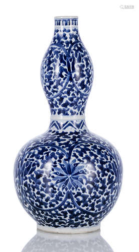 A BLUE AND WHITE GOURD-SHAPED PORCELAIN LOTOS VASE