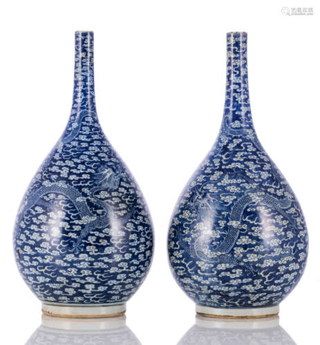 A PAIR OF BLUE AND WHITE 'DRAGONS IN THE CLOUDS' BOTTLE VASES