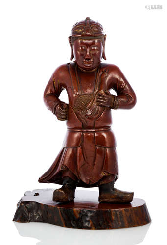 A CARVED AND LACQUERED WOOD FIGURE OF A STANDING BOY WEARING AN ARMOR