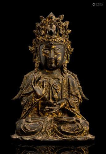 A BRONZE FIGURE OF SEATED GUANYIN WITH REMNANTS OF LACQUER GILDING