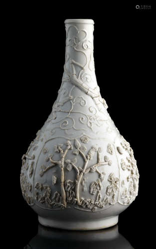 A RARE WHITE-GLAZED BOTTLE VASE WITH UNGLAZED RELIEF OF TREES AND CHILONGS