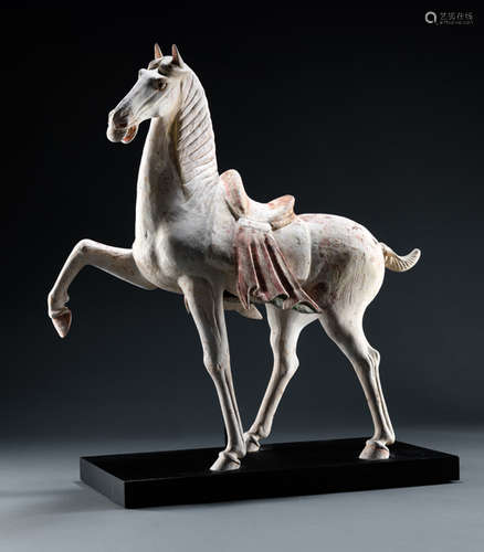 A PAINTED EARTHENWARE MODEL OF A PRANCING HORSE