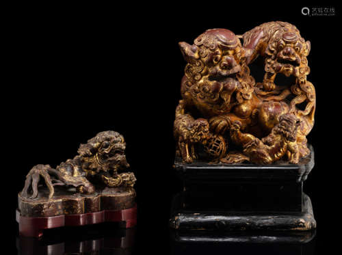 TWO WOOD AND STONEWARE CARVINGS OF FO LIONS