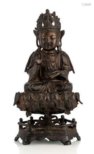 A BRONZE FIGURE OF GUANYIN ON A LOTUS BASE