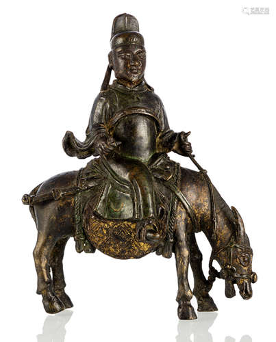 A BRONZE FIGURE OF A DAOIST RIDING A DONKEY