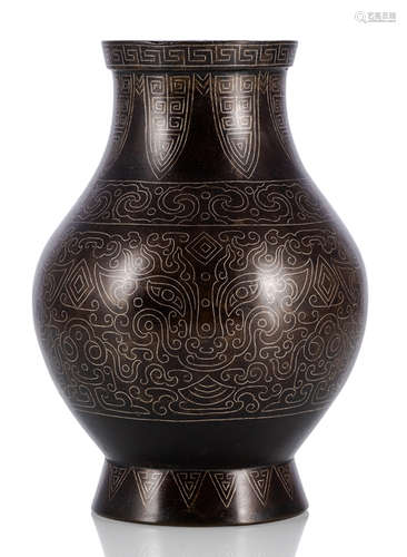 A SILVER- INLAID HU-SHAPED BRONZE VASE IN ARCHAIC STYLE