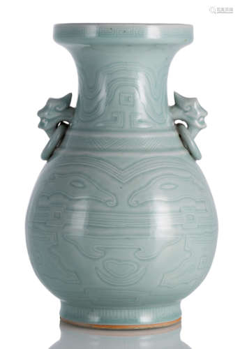 A CELADON-GLAZED VASE WITH WIDE MOUTH AND MYTHOLOGICAL CREATURE HANDLES