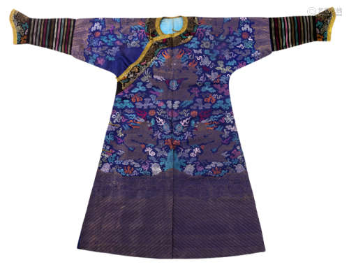 A BLUE SILK ROBE WITH POLYCHROME EMBROIDERY AND WOVEN MOTIFS OF NINE DRAGONS