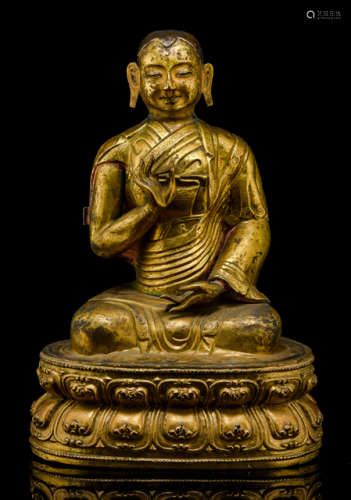 A GILT-REPOUSSÉ AND BRONZE FIGURE OF A LAMA