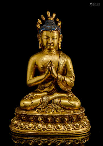 A GILT-BRONZE FIGURE OF NAGARJUNA