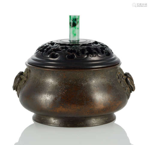 A BRONZE CENSER WITH ANIMAL HEAD APPLICATIONS