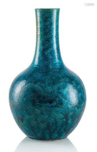 A BLUE-GREEN GLAZED DRAGON AND WAVES PORCELAIN BOTTLE VASE