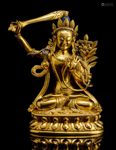 A GILT-BRONZE FIGURE OF MANJUSHRI