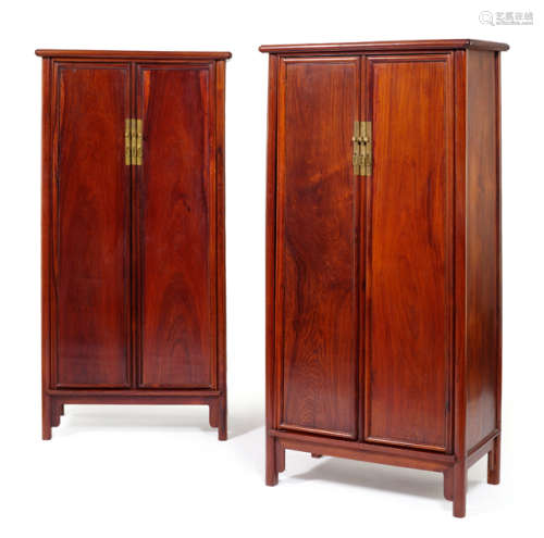 A PAIR OF HARDWOOD CABINETS WITH ROUND CORNERS