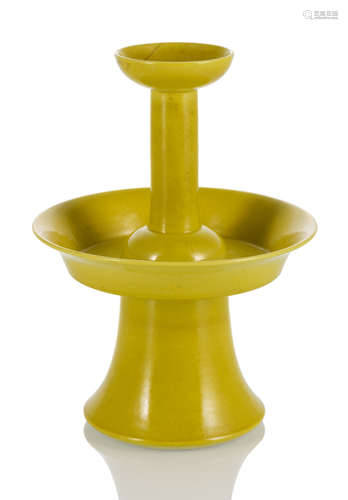 A TWO-TIERED LEMON-YELLOW-GLAZED CANDLESTICK