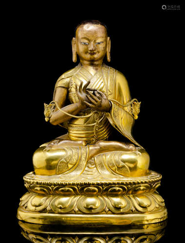 THREE GILT-COPPER EMBOSSED FIGURES OF A LAMA