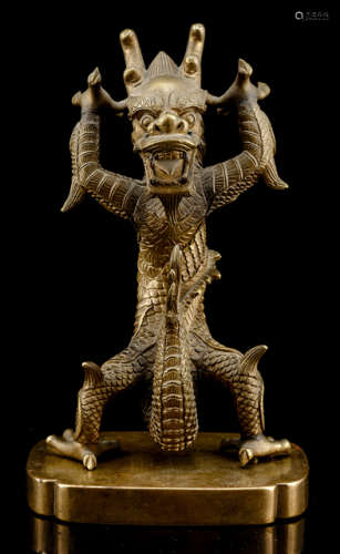 A BRONZE MODEL OF A STANDING DRAGON