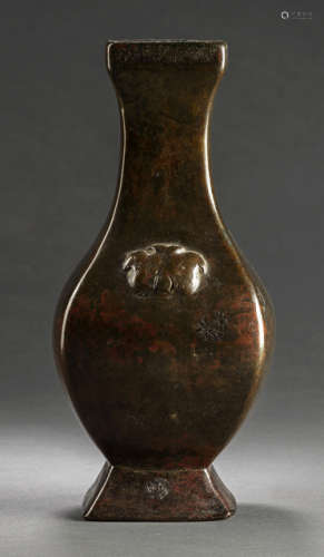 A HU-SHAPED BRONZE VASE WITH MASK RELIEF
