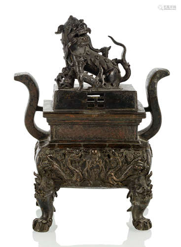 A BRONZE CENSER WITH COVER AND LION HANDLE