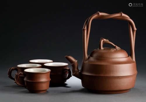 A ZISHA TEAPOT AND COVER AND FOUR CUPS