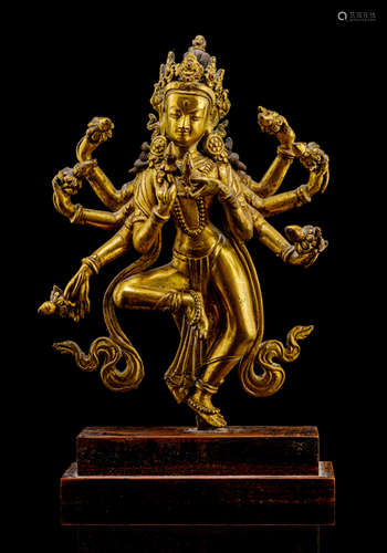 A GILT-BRONZE FIGURE OF A DIVINITY