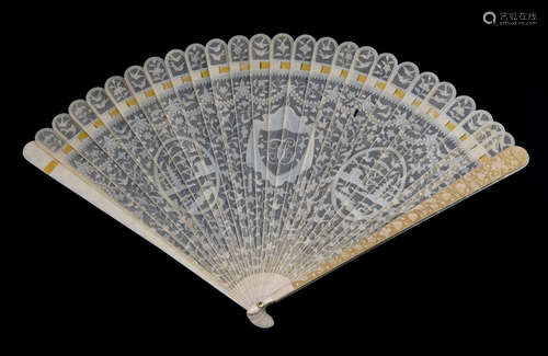 A FINE CARVED IVORY BRISÉ FAN WITH ROUNDELS DEPICTING CHINESE LANDSCAPES AND A MONOGRAM