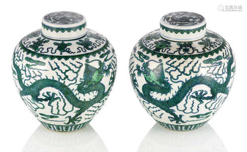 A PAIR OF BLUE AND WHITE AND GREEN DRAGON JARS AND COVERS