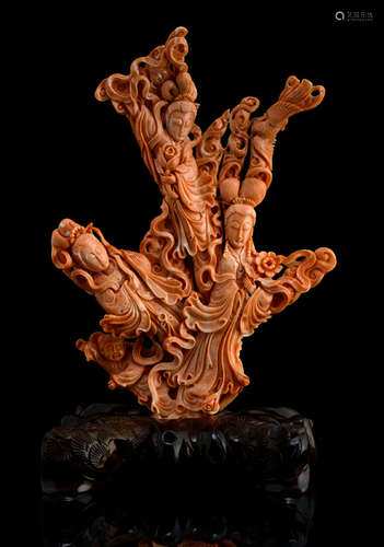 A RED CORAL CARVING OF THREE LADIES AND A BOY